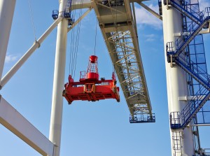 Big industrial crane rising into sky